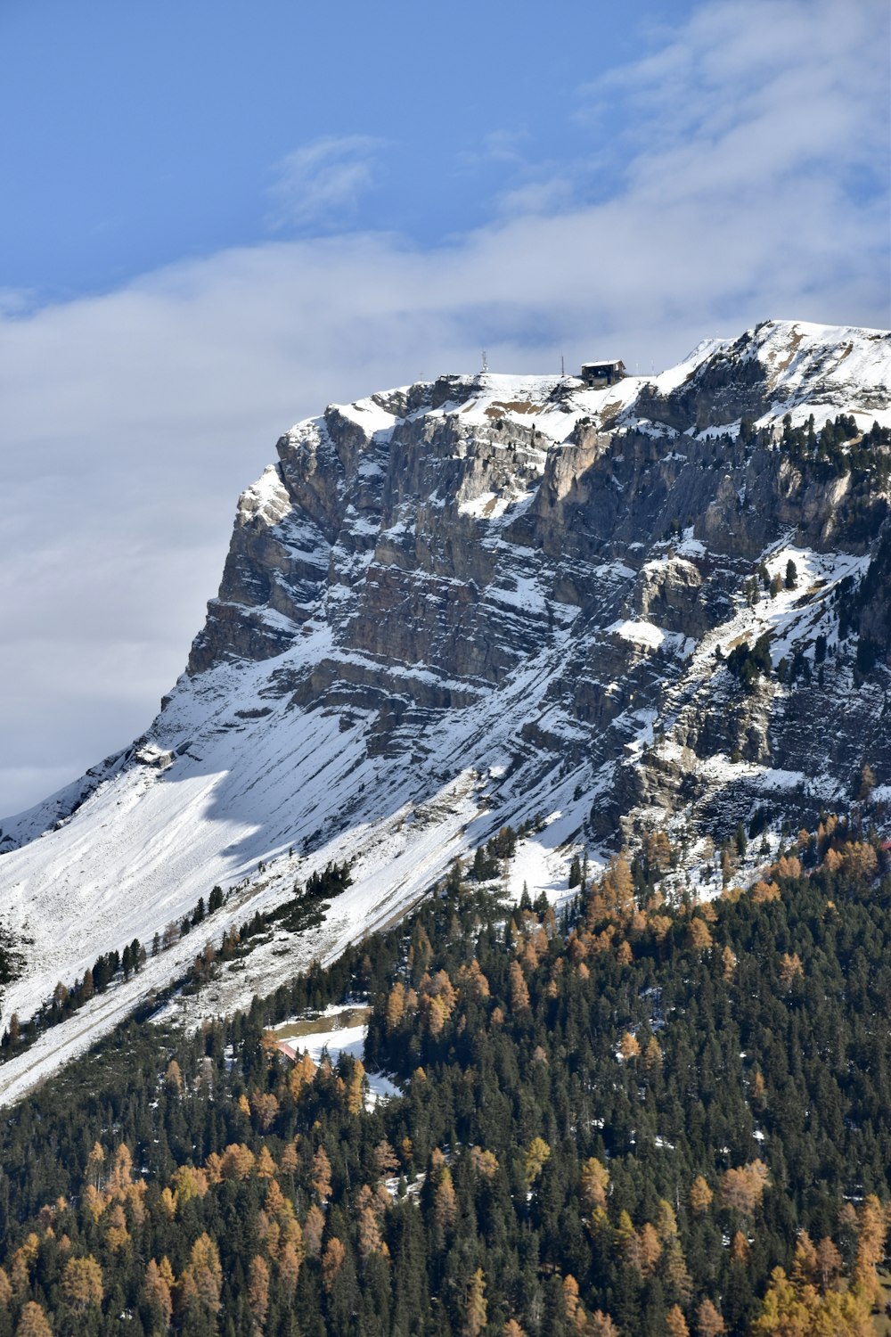 snow covered mountain under cloudy sky during daytime