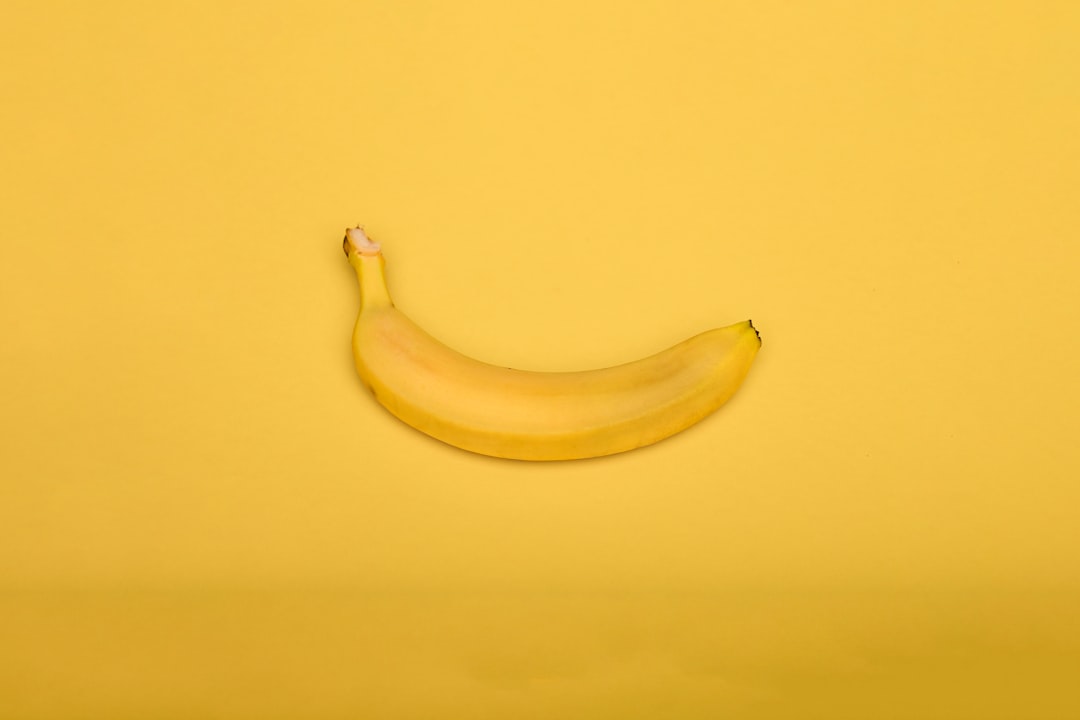 yellow banana on yellow surface