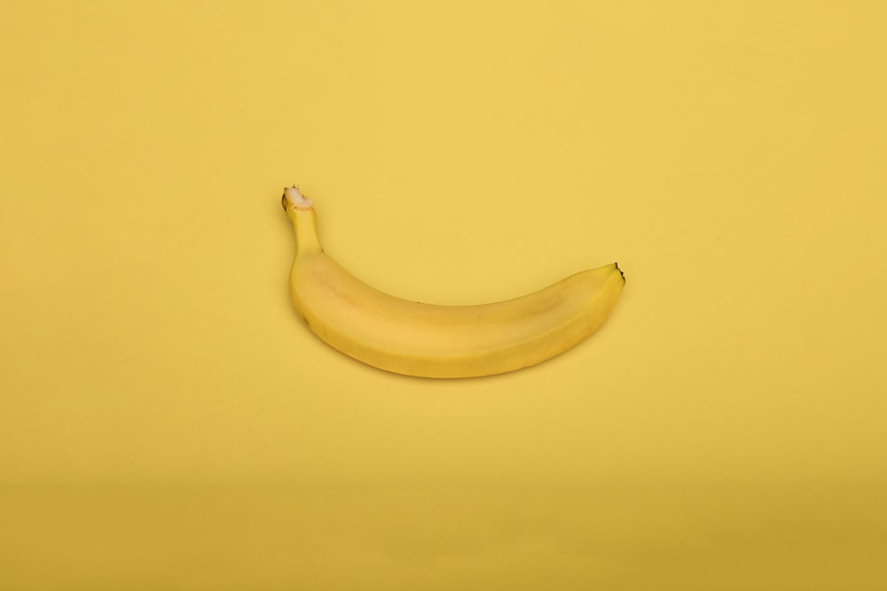 yellow banana on yellow surface