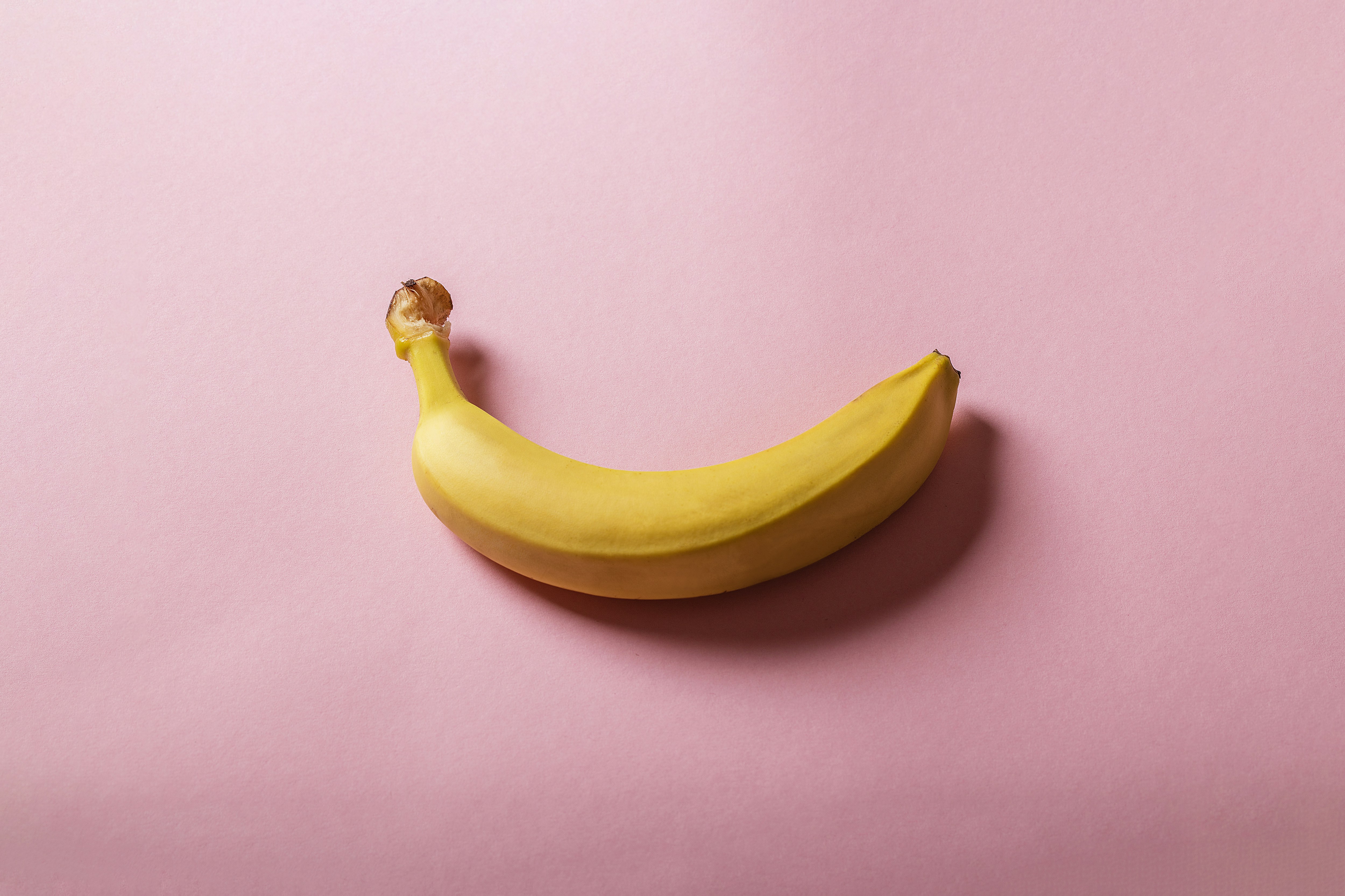 yellow banana on white table