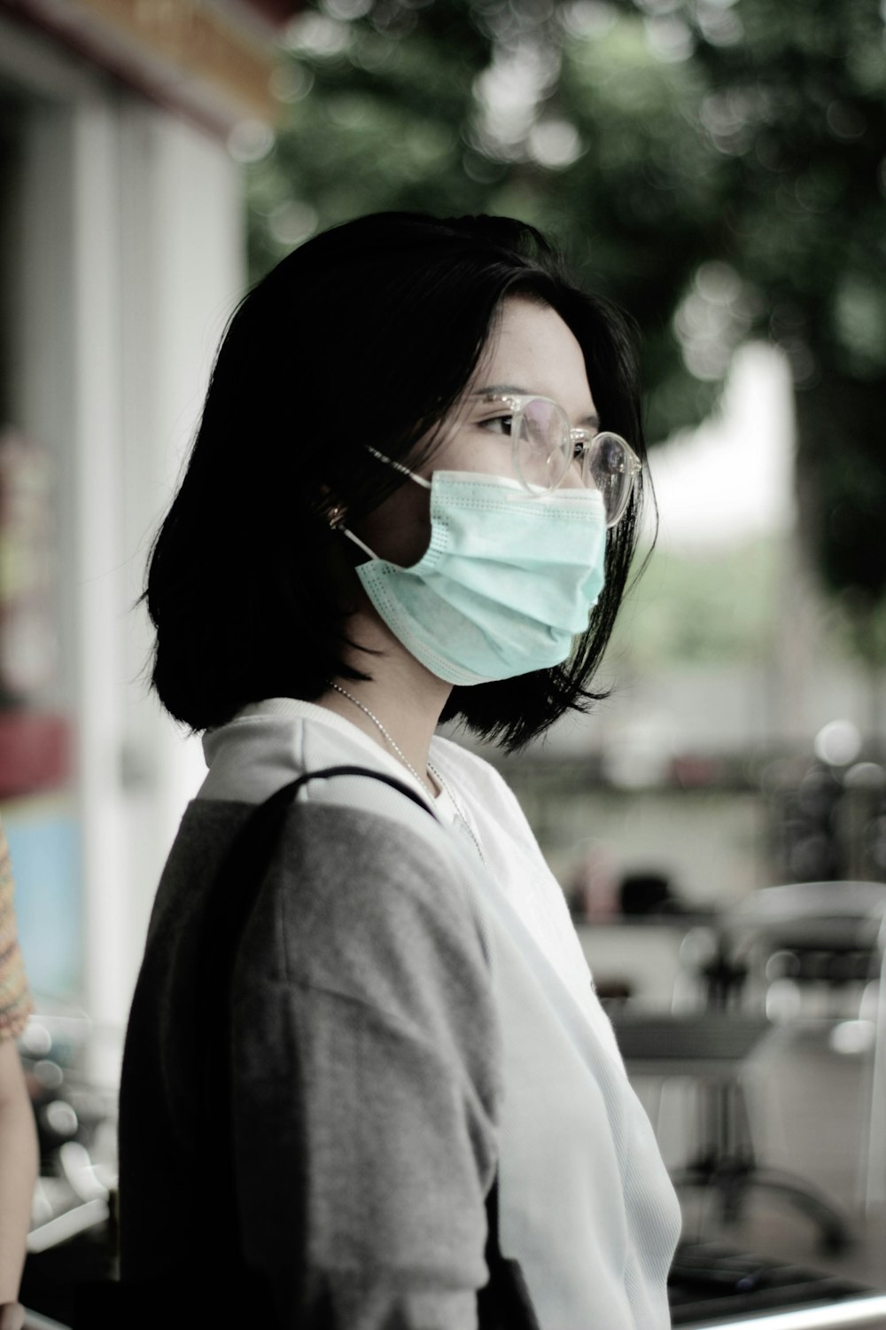 woman in white collared shirt wearing green goggles