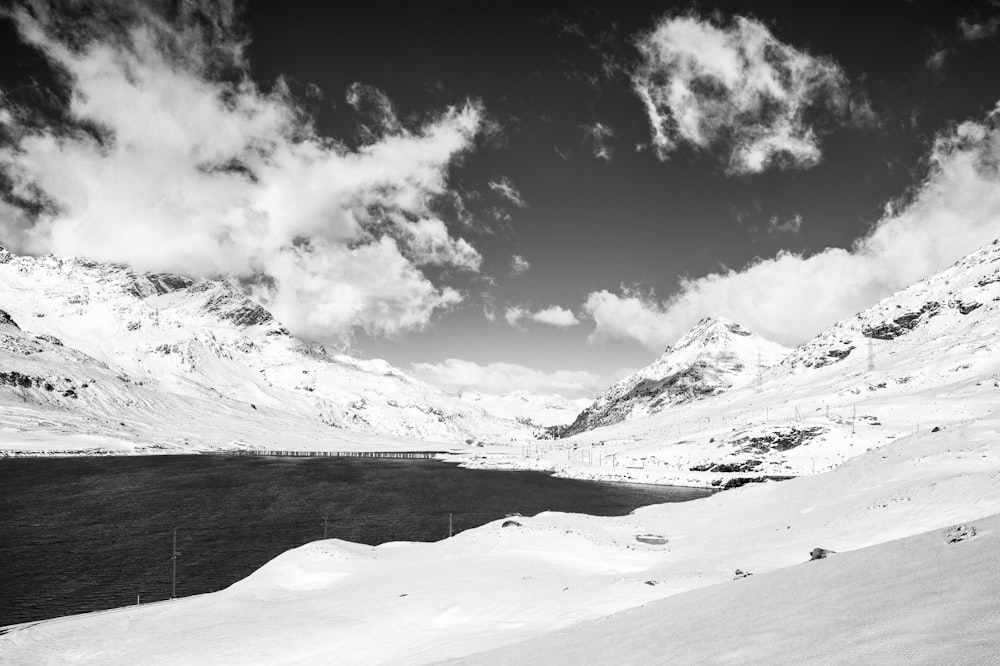 snow covered mountain under cloudy sky during daytime