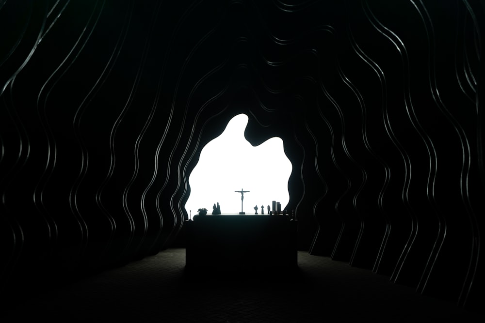 silhouette of person sitting on bench