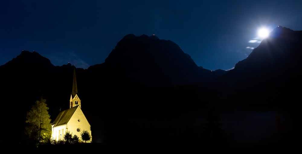 silhouette of mountain during night time