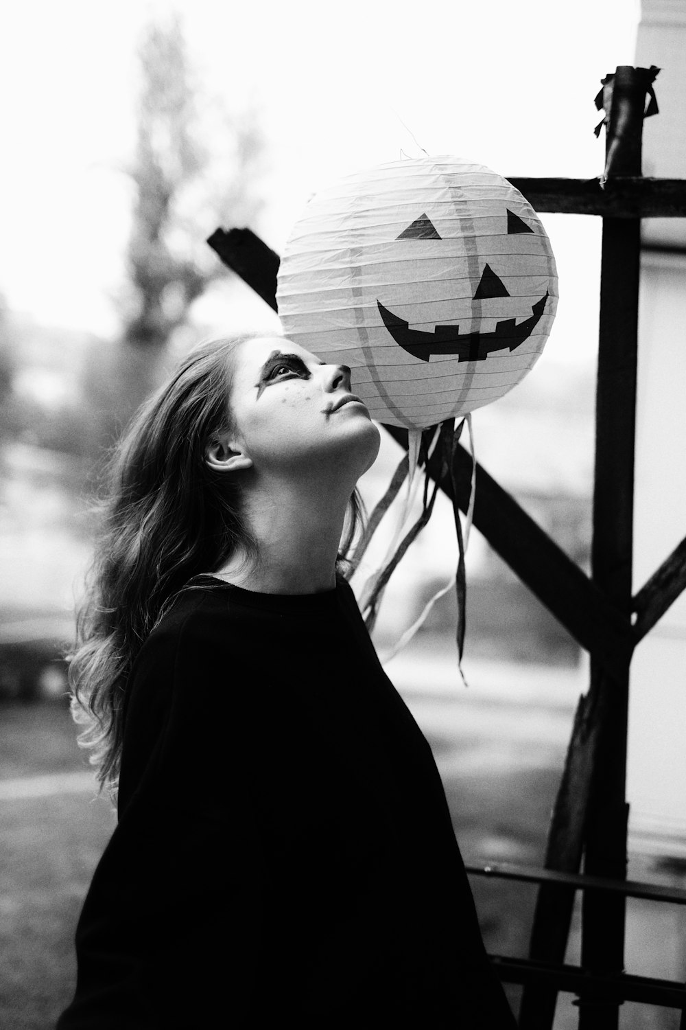 woman in black crew neck shirt holding soccer ball