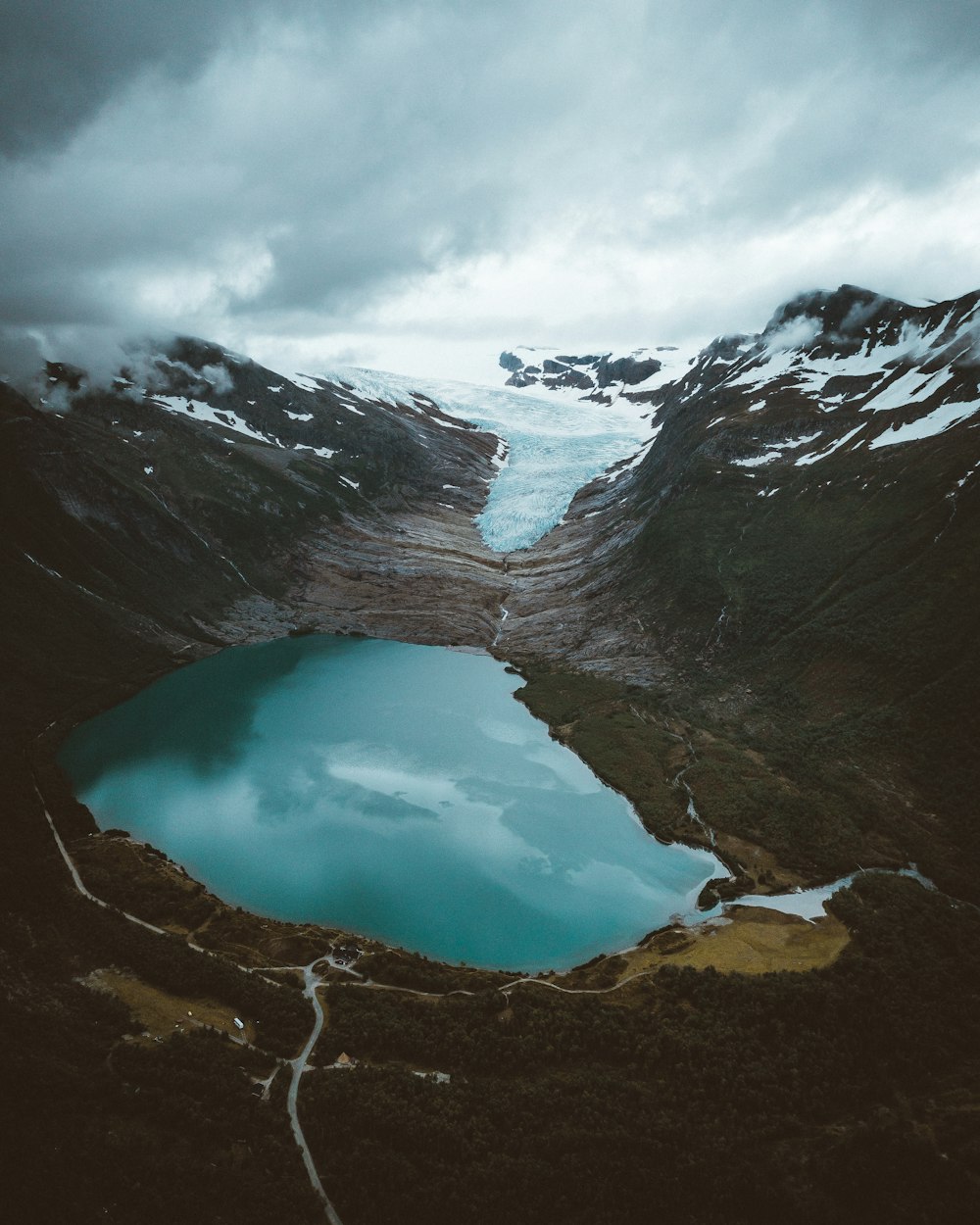 lake in the middle of mountains