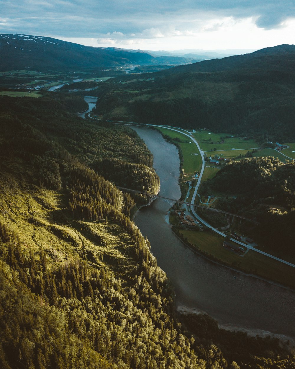 aerial view of green and brown mountains and river