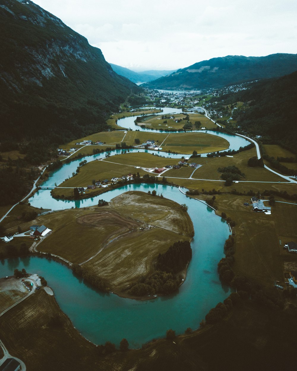 aerial view of river between mountains during daytime