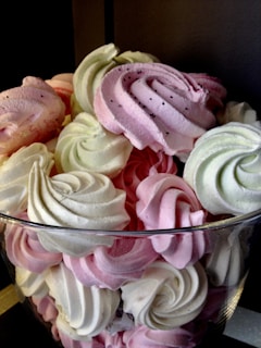 A selection of meringues in various colors and shapes.