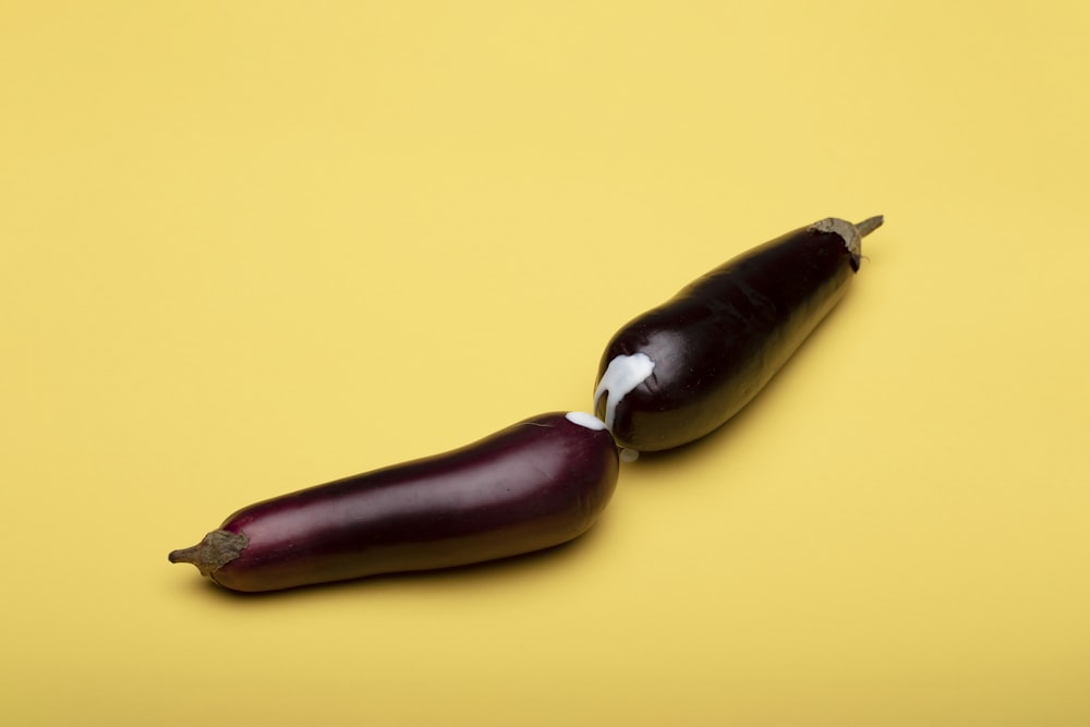 brown oval fruit on yellow surface