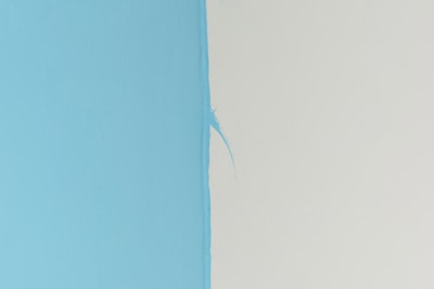 blue textile on white surface