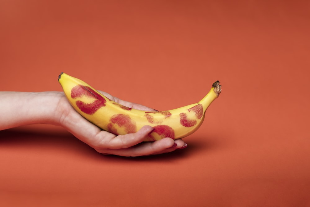 person holding yellow banana fruit