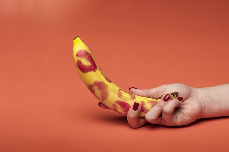 person holding yellow banana fruit