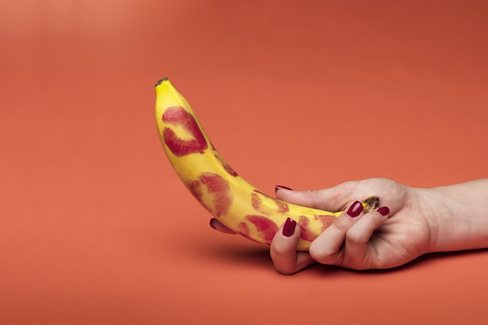 person holding yellow banana fruit