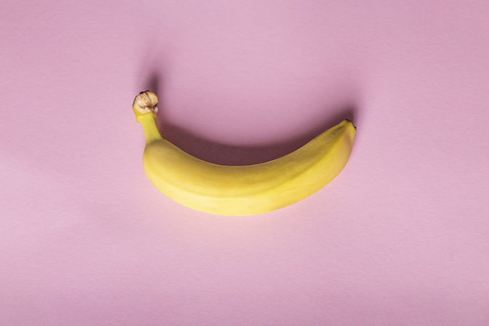 yellow banana on purple table