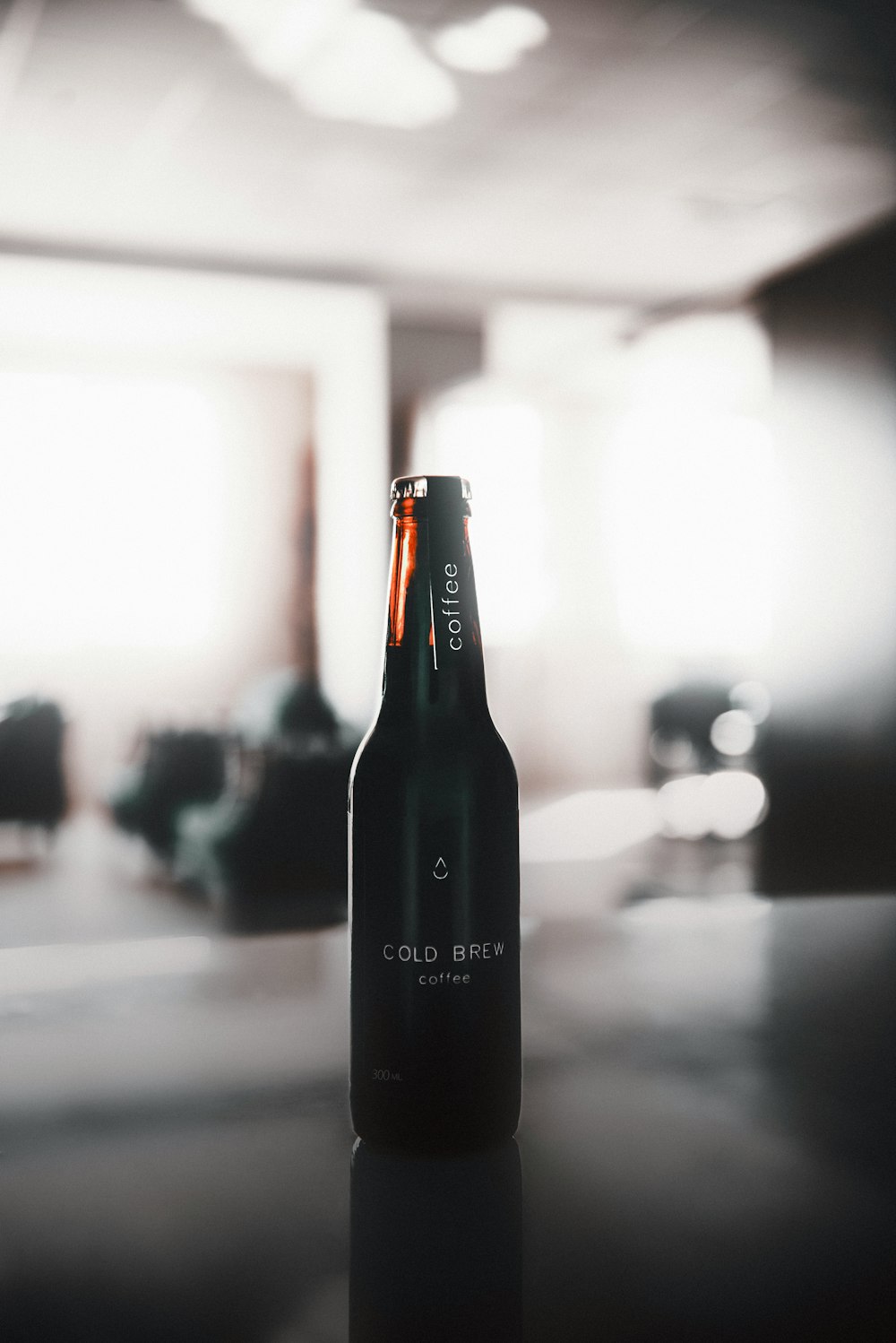 black glass bottle on table