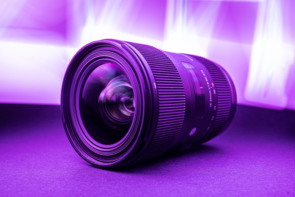 black camera lens on pink textile