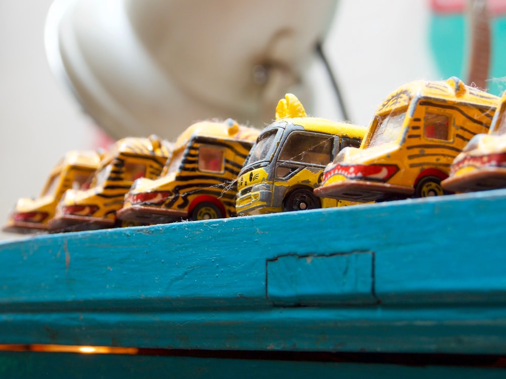 yellow and orange plastic toy car