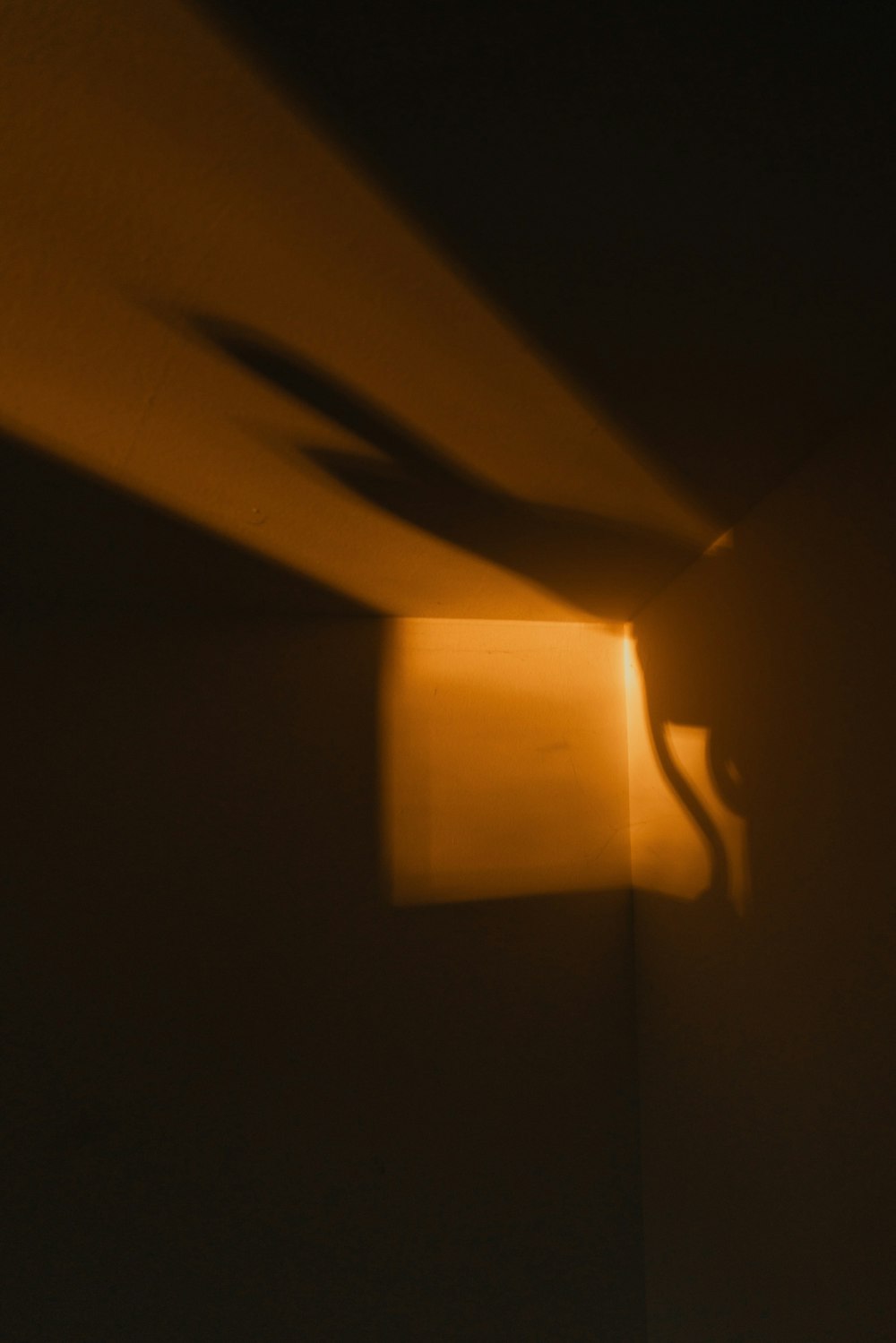 yellow light bulb turned on in dark room