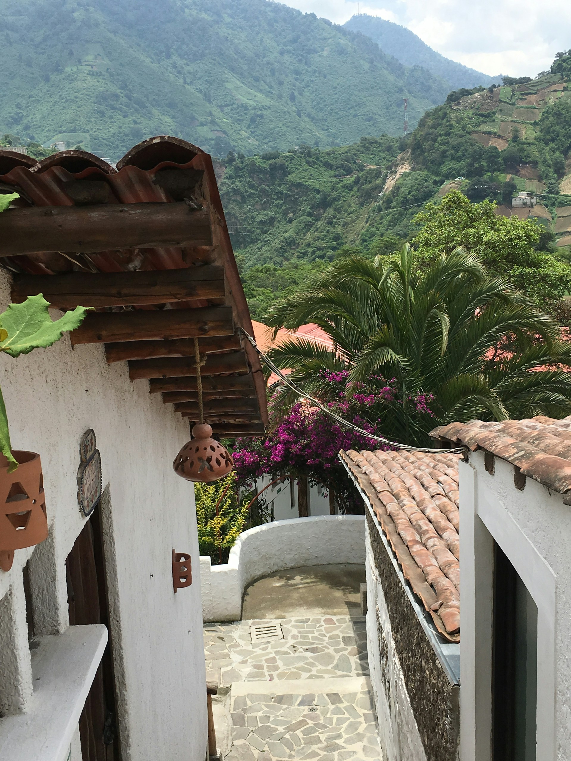 woman wearing yellow long-sleeved dress under white clouds and blue sky during daytime