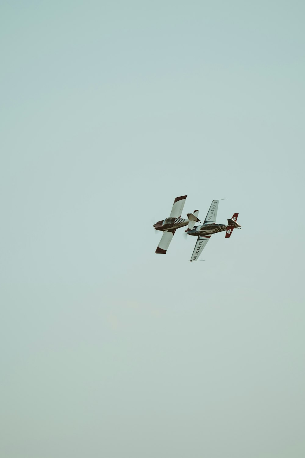 white and black drone in mid air