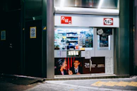 Friendly staff member assisting a customer at the counter, surrounded by tobacco products and local touches.