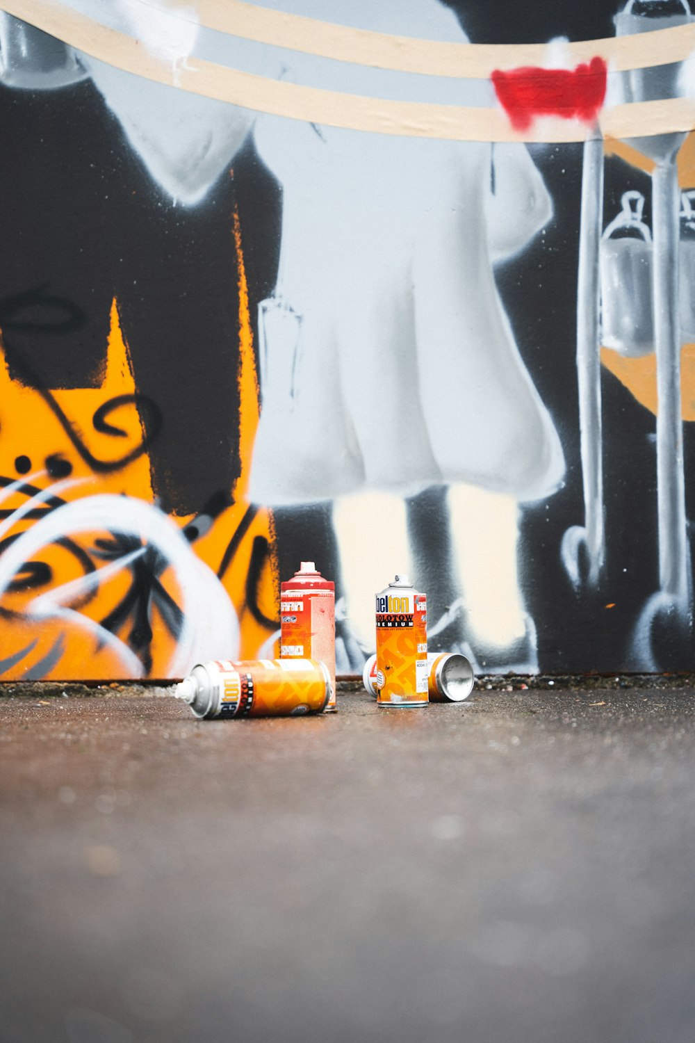 white and orange can on black table