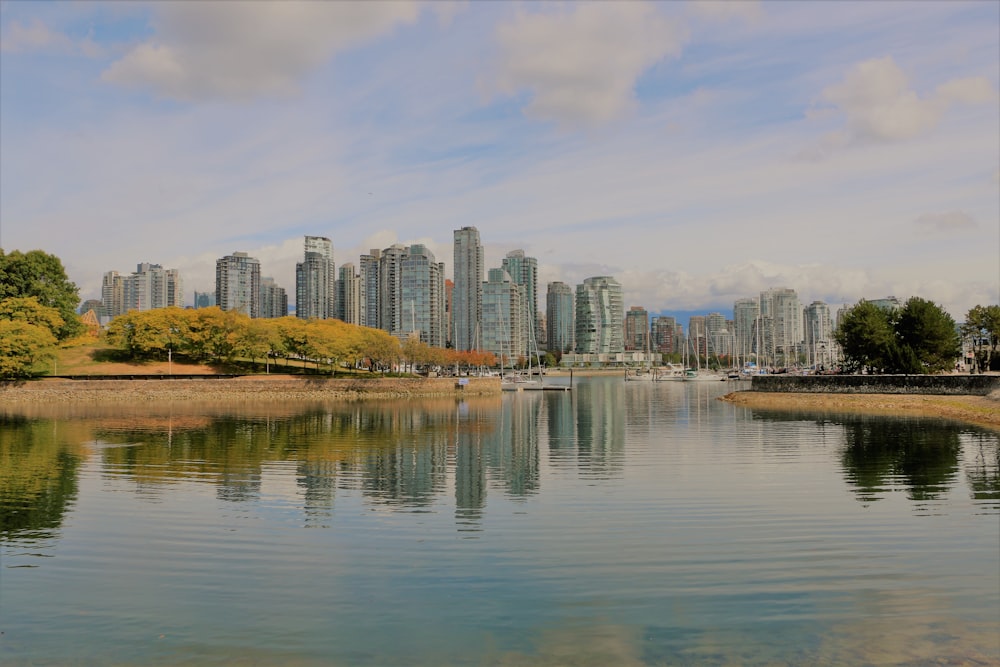 city skyline across body of water during daytime