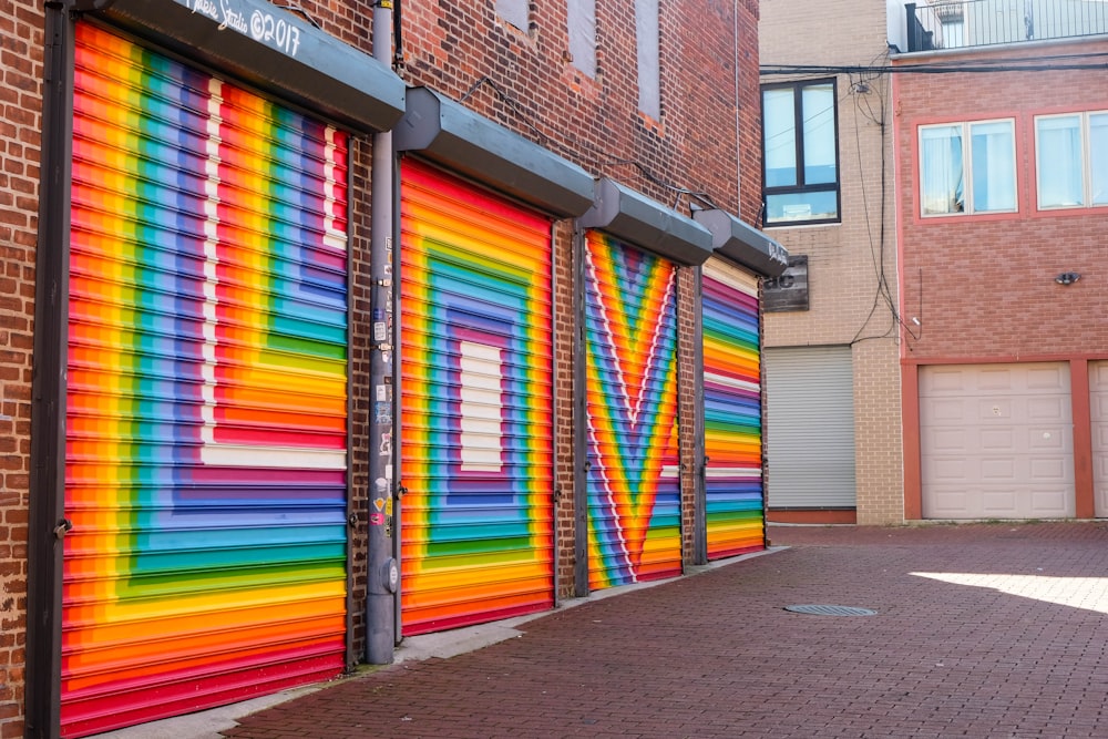 multi color wooden door on brown brick building