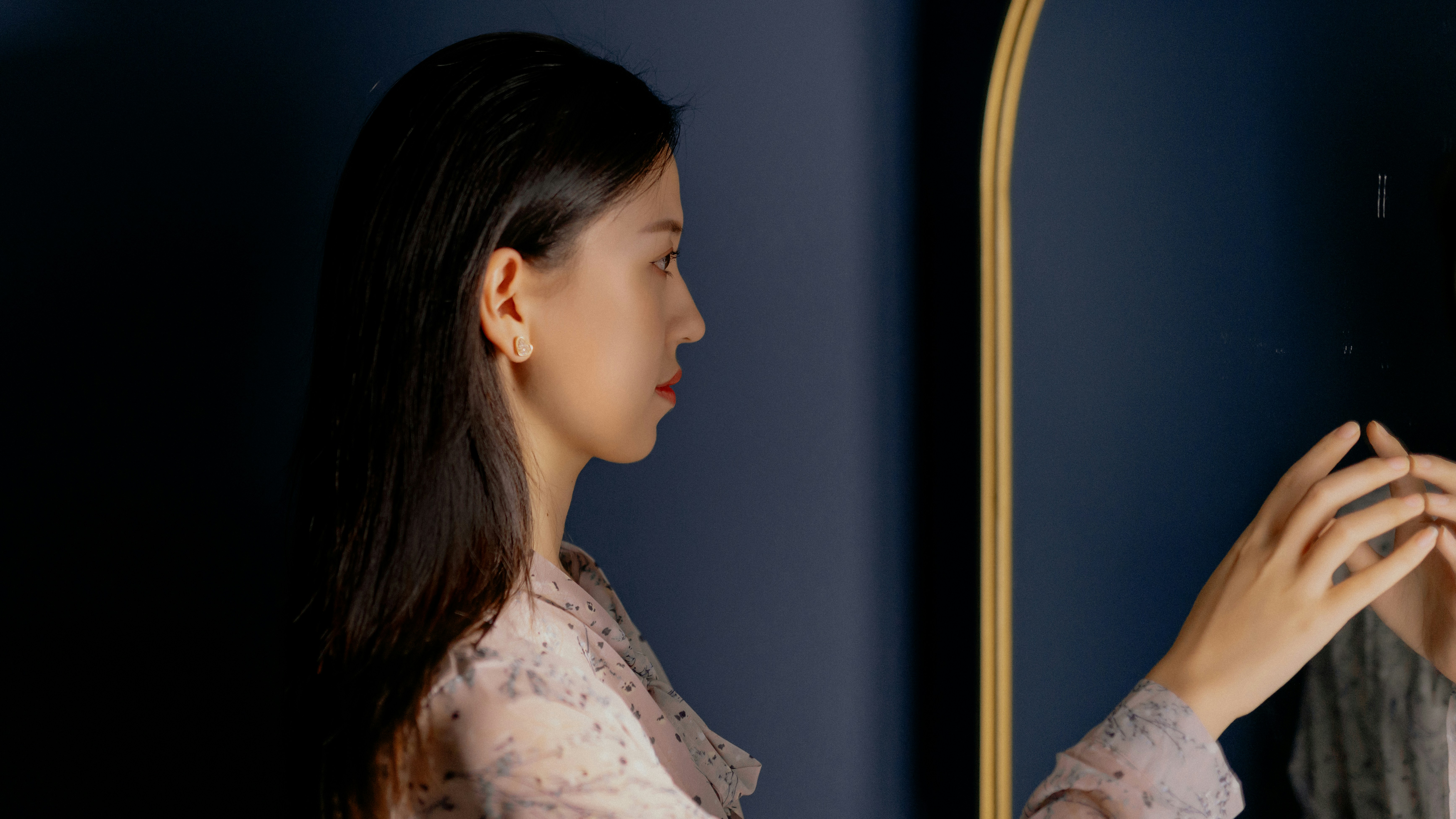 Woman in white floral shirt