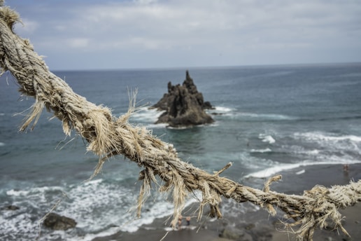 brown rope on beach during daytime