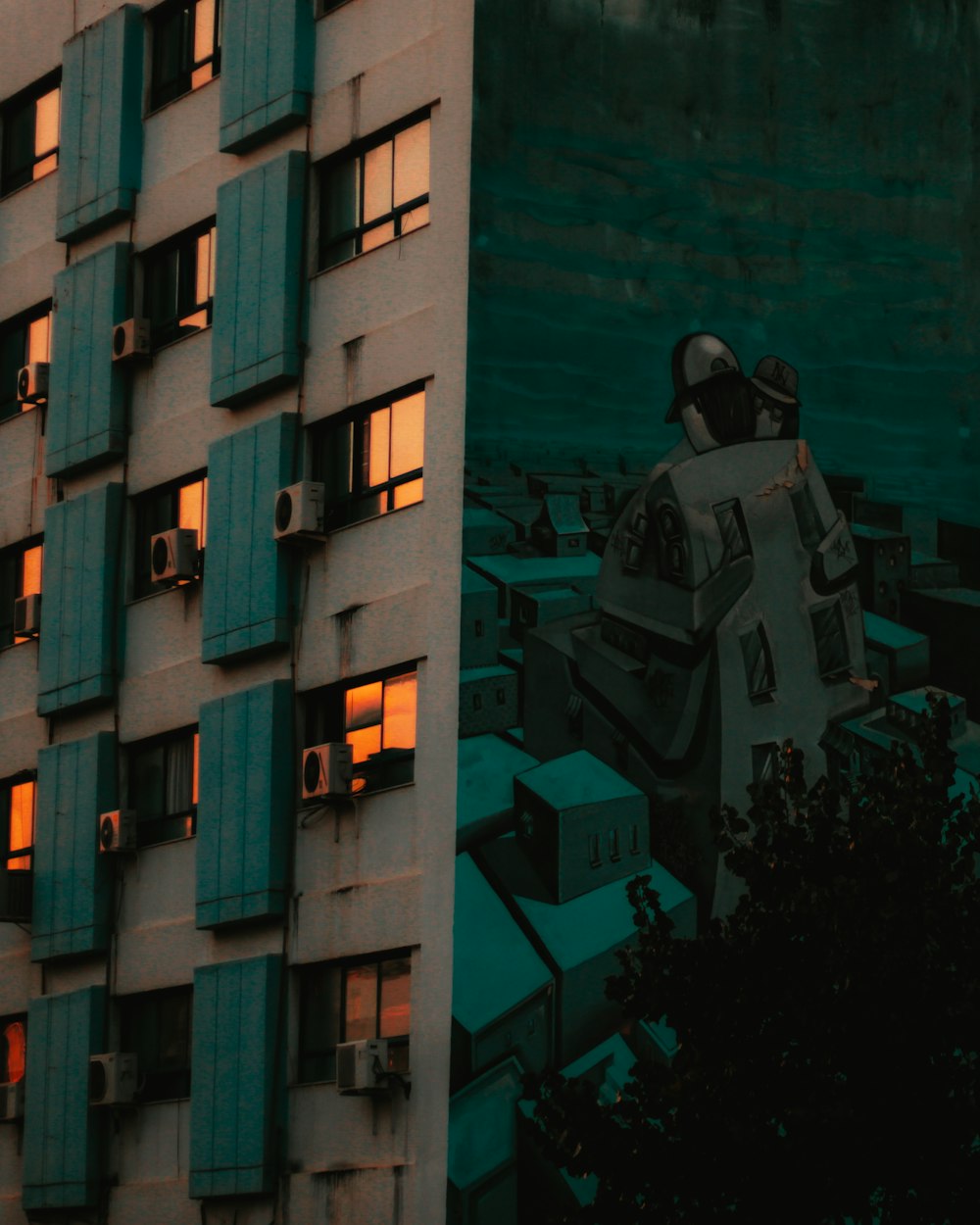 man in black jacket standing beside building