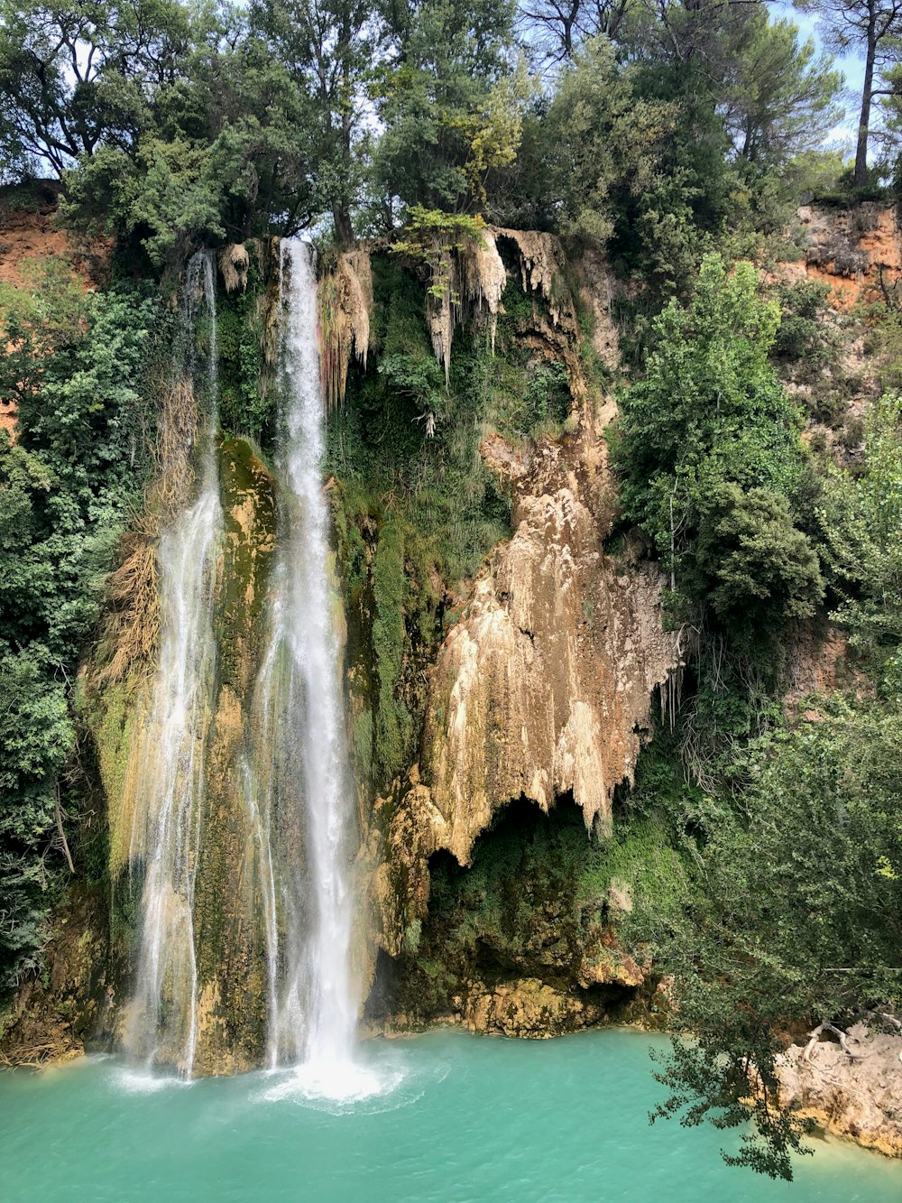 waterfalls in the middle of the forest