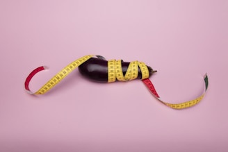 yellow and black strap on white surface