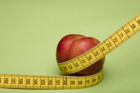 red apple fruit on brown wooden tape