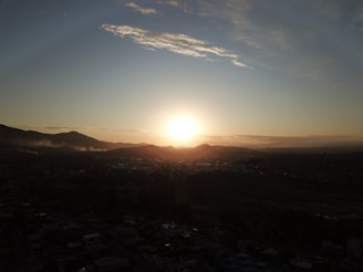 A picturesque sunset over a mountain range.