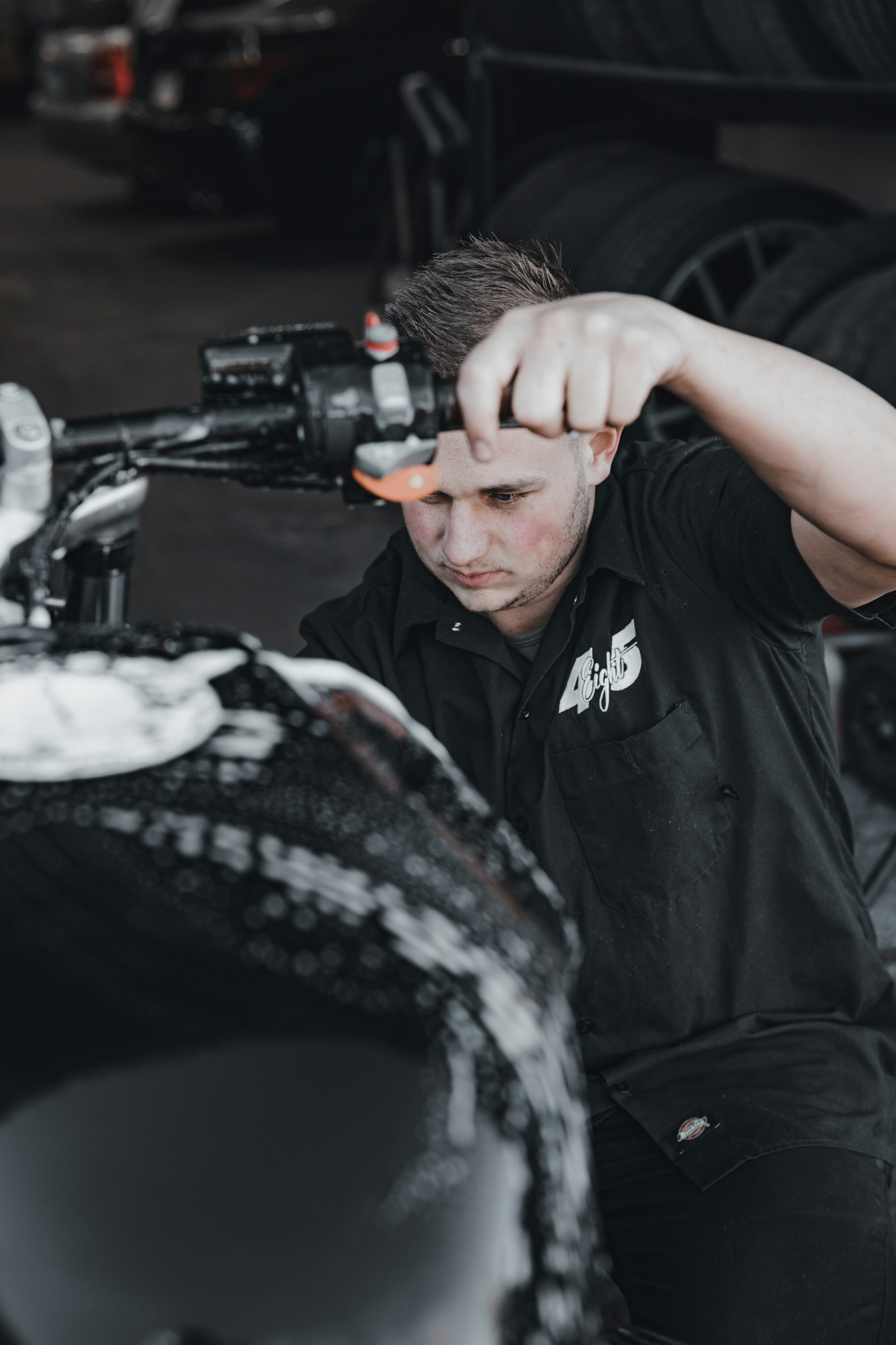 black and brown leather padded tub sofa