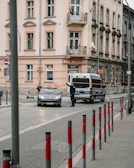 A crowded street cordoned off by police tape during an ongoing investigation.