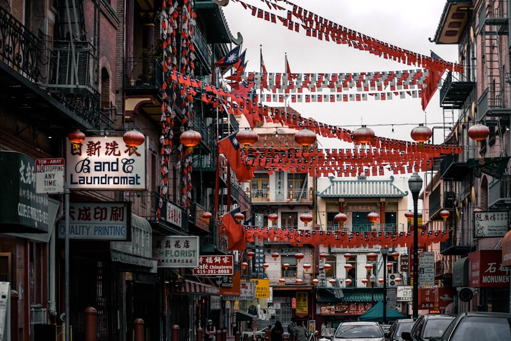 red chinese lanterns on street during daytime