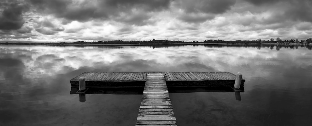 grayscale photo of wooden dock