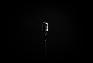 black microphone on black background