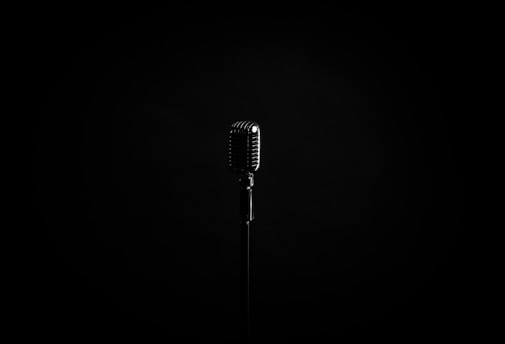 black microphone on black background