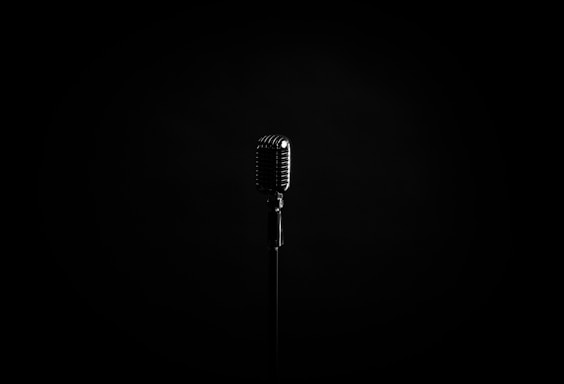 black microphone on black background