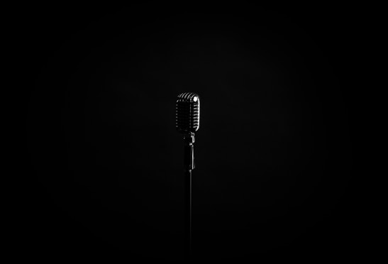 black microphone on black background
