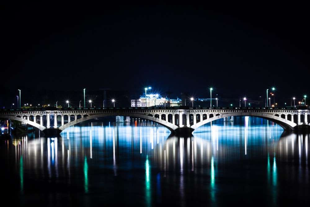 bridge over water during night time