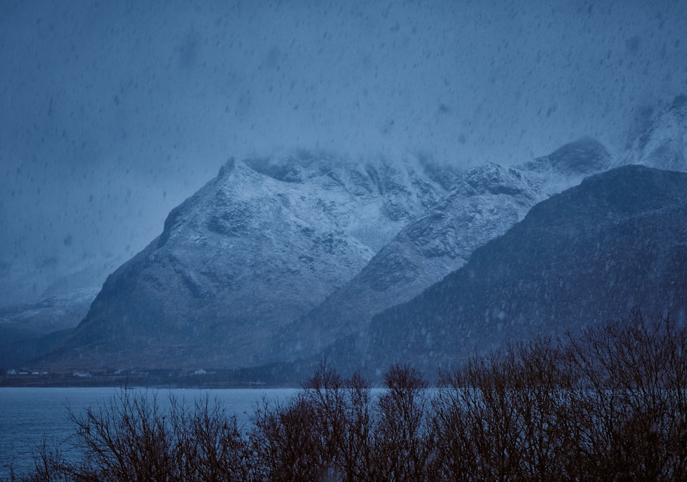 snow covered mountain during night time