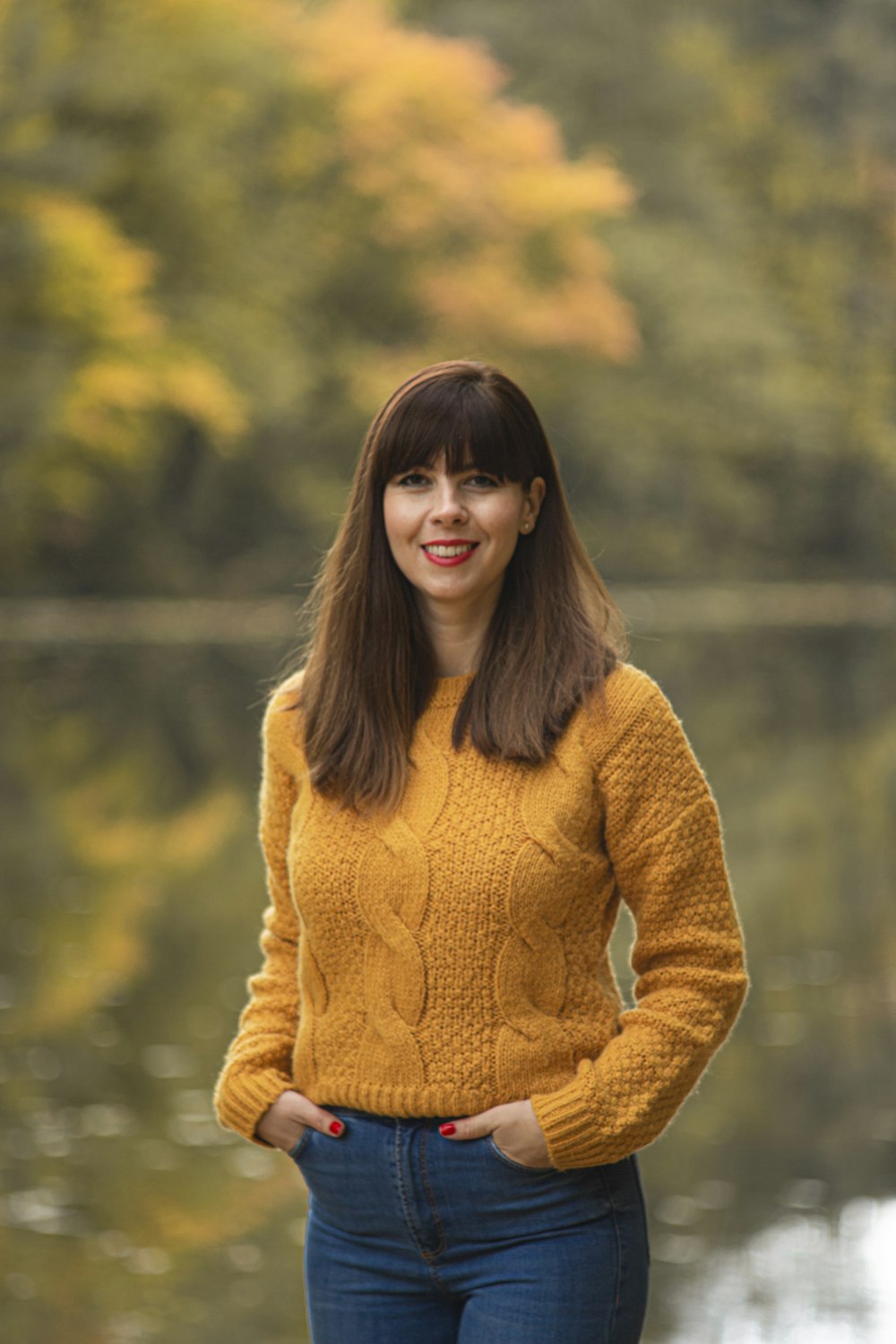 woman in yellow sweater smiling