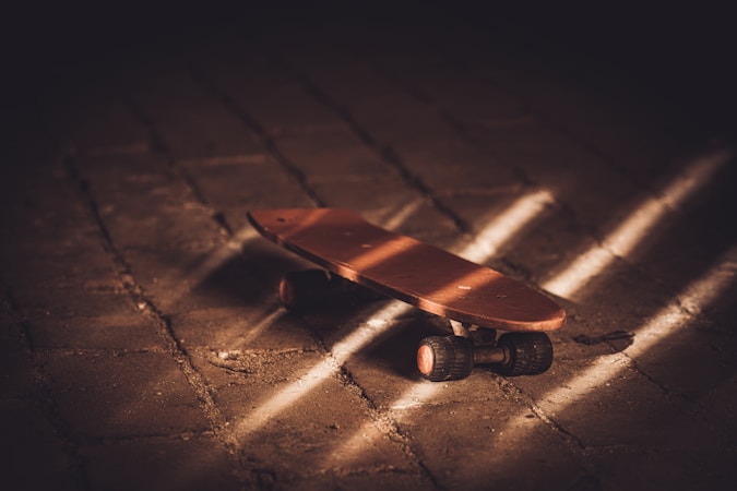 Vintage skateboard deck showing wood grain and design