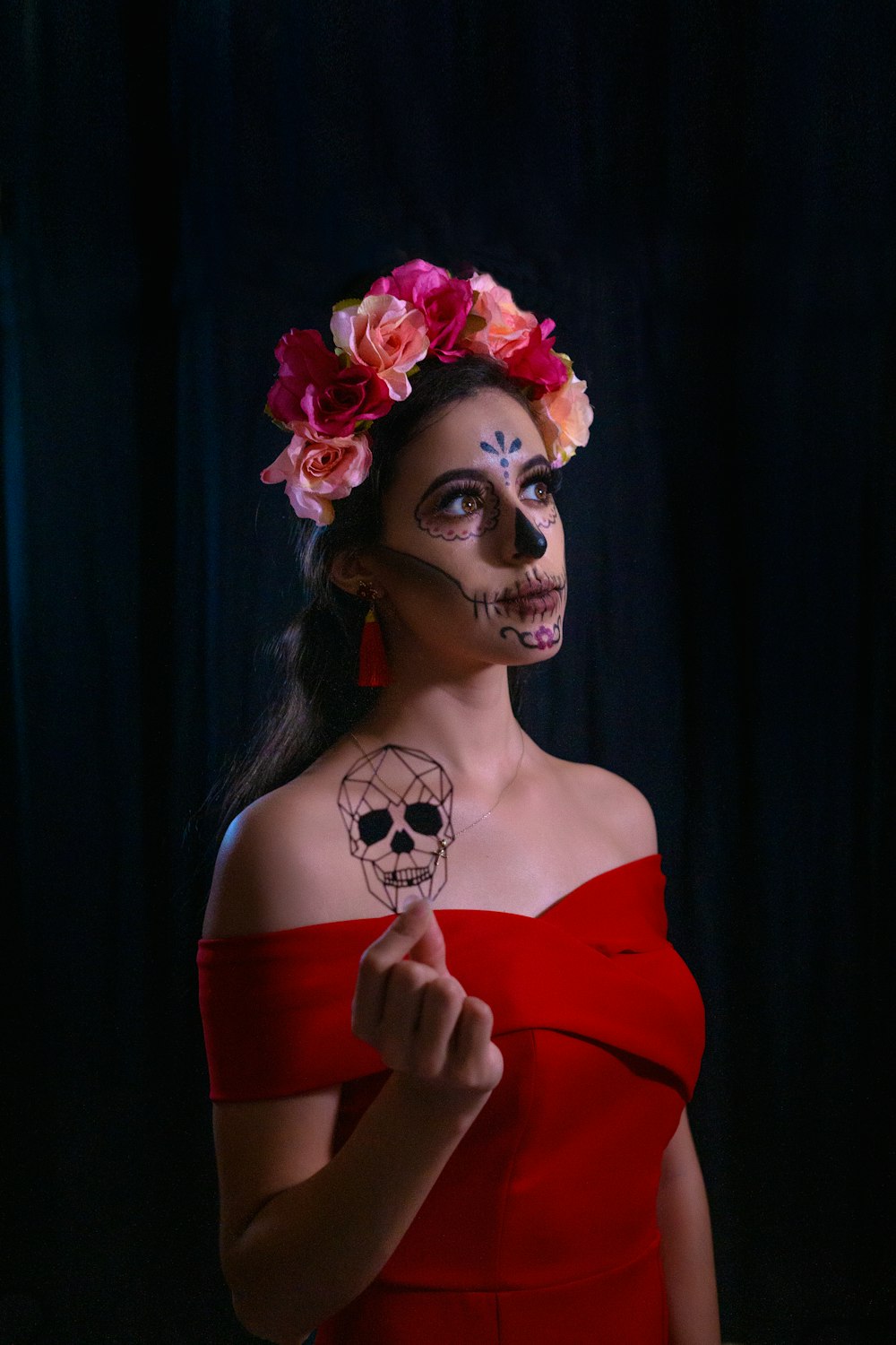 woman in red off shoulder dress with white flower on head