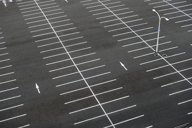 black top with white lines in a large parking lot that was striped